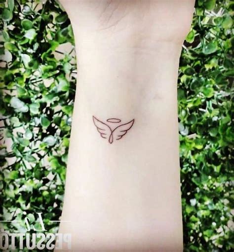 small tattoos of angels|minimalist angel wing tattoo.